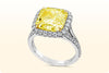 GIA Certified 5.32 Carat Radiant Cut Fancy Yellow Diamond Halo Engagement Ring in White Gold and Yellow Gold