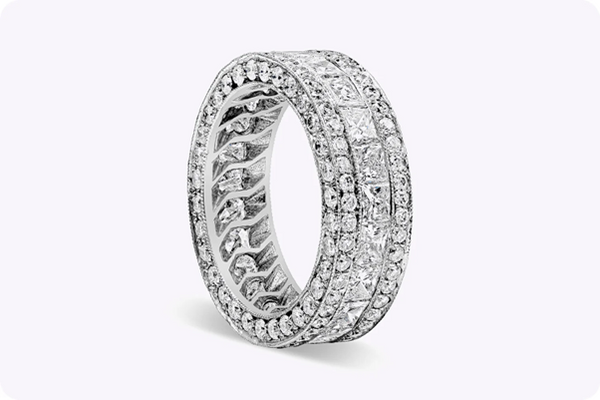 An elegant diamond wedding ring in a white background