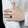 5.04 Carats Emerald Cut Blue Sapphire with Diamond Three-Stone Engagement Ring in Platinum