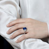5.04 Carats Emerald Cut Blue Sapphire with Diamond Three-Stone Engagement Ring in Platinum
