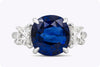 6.15 Carats Cushion Cut Blue Sapphire and Diamond Three-Stone Engagement Ring in Platinum