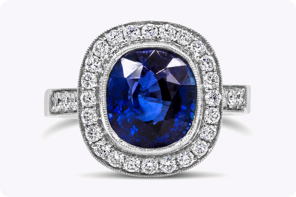 4.12 Carats Cushion Cut Royal Blue Sapphire & Diamond Halo Engagement Ring in White Gold