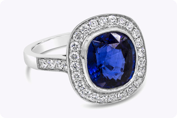 4.12 Carats Cushion Cut Royal Blue Sapphire & Diamond Halo Engagement Ring in White Gold