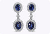 2.65 Carats Oval Cut Blue Sapphire and Diamond Halo Dangle Earrings in White Gold
