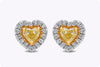 0.69 Carats Total Heart Shape Fancy Yellow Diamond Halo Stud Earrings in Yellow Gold and Platinum
