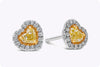 0.69 Carats Total Heart Shape Fancy Yellow Diamond Halo Stud Earrings in Yellow Gold and Platinum