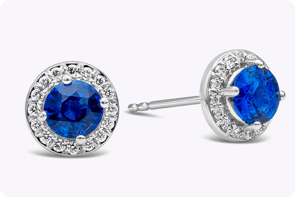 1.28 Carats Blue Sapphire with Diamonds Halo Stud Earrings in White Gold