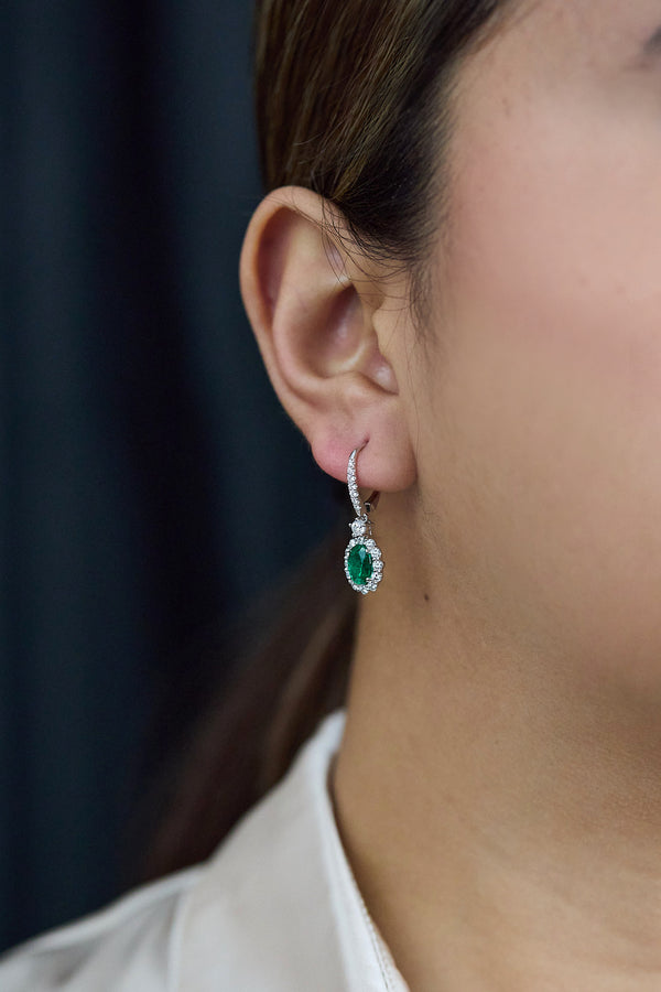 1.95 Carats Oval Cut Emerald & Diamond Halo Dangle Earrings in White Gold