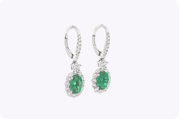 1.95 Carats Oval Cut Emerald & Diamond Halo Dangle Earrings in White Gold