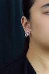 Elegant 1.77 carat round and pear-shaped diamond earrings in white gold