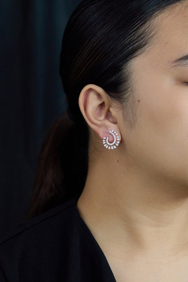 1.77 carat round and pear-shaped diamond earrings in white gold