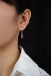 1.49 Carats Pear Shape Ruby and Round Diamond Halo Dangle Earrings in White Gold