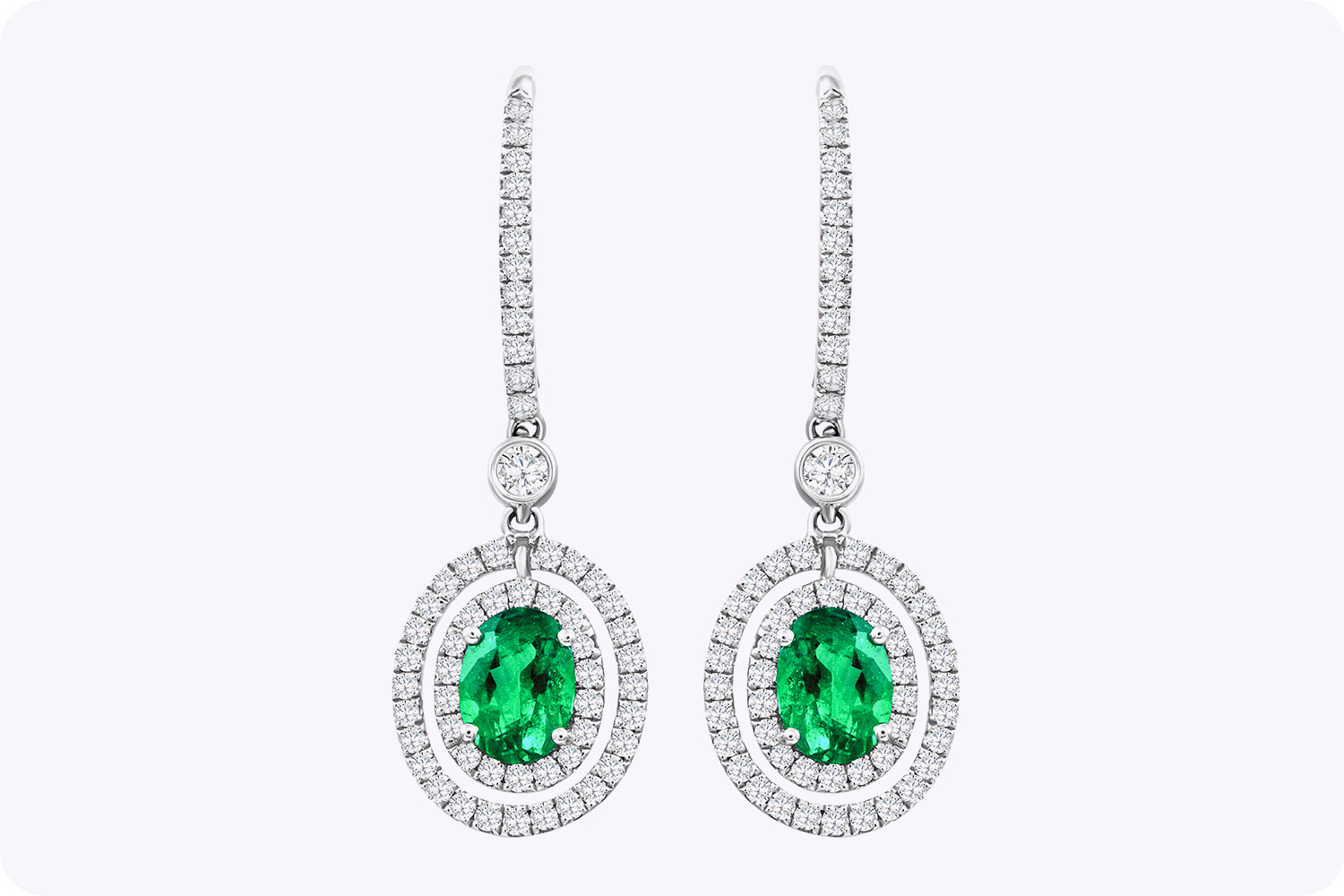 1.01 Carats Total Oval Cut Emerald and Diamond Halo Dangle Earrings in White Gold