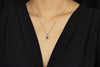 0.52 Carat Oval Cut Blue Sapphire and Diamond Halo Pendant Necklace in White Gold