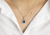 1.64 Carats Emerald Cut Sapphire with Diamond Halo Pendant Necklace in White Gold