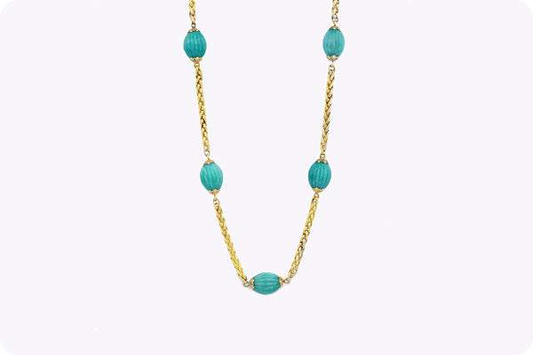 Shop the carved oval turquoise necklace in yellow gold