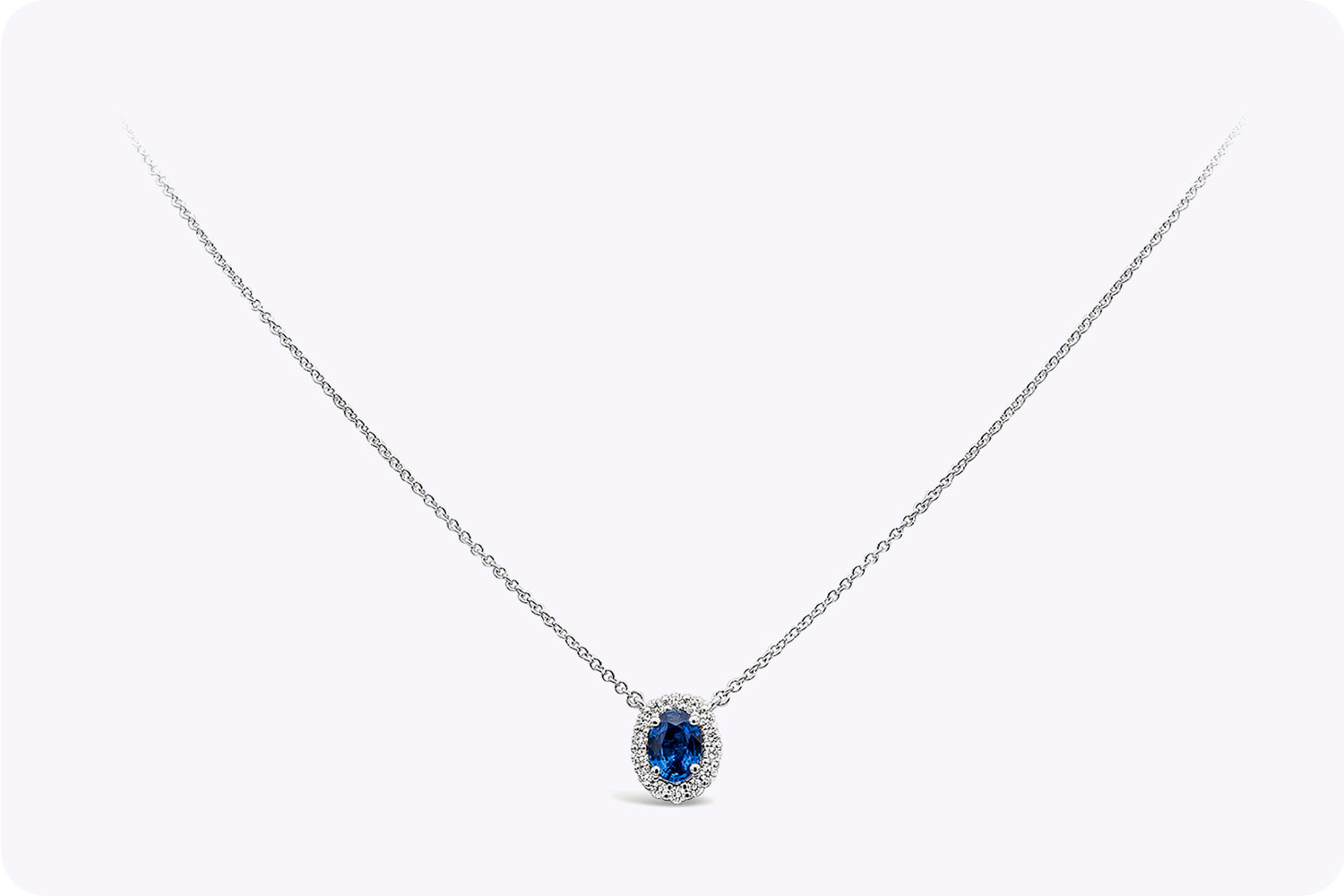 0.73 Carat Oval Cut Sapphire & Diamond Halo Pendant Necklace in White Gold