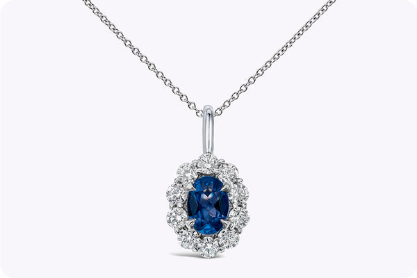 0.73 Carat Total Oval Cut Sapphire & Diamond Halo Pendant Necklace in White Gold