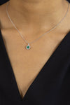 0.33 Carat Round Cut Emerald & Diamond Halo Pendant Necklace in White Gold