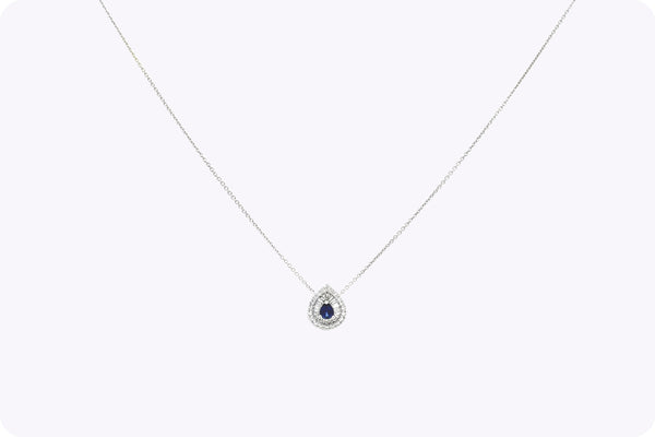 Stunning 0.42 carat pear shape sapphire and diamond halo pendant necklace