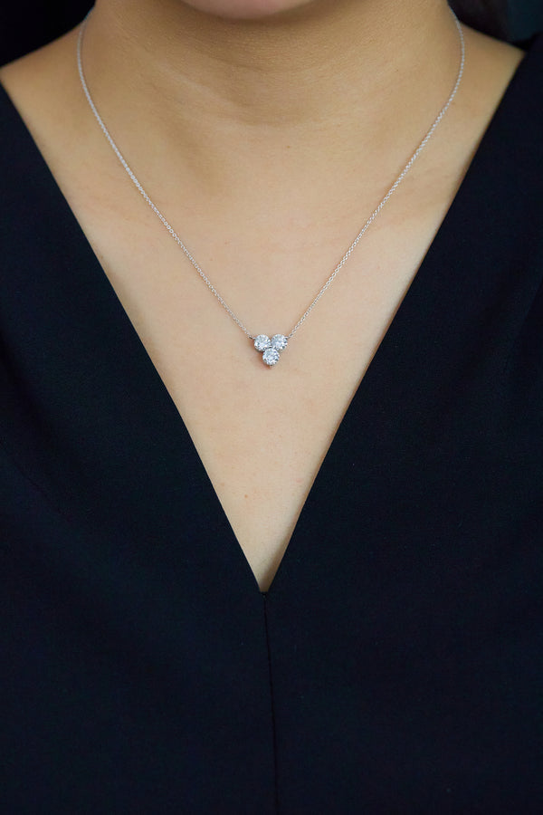 Elegant round brilliant cut diamond clover pendant necklace in platinum