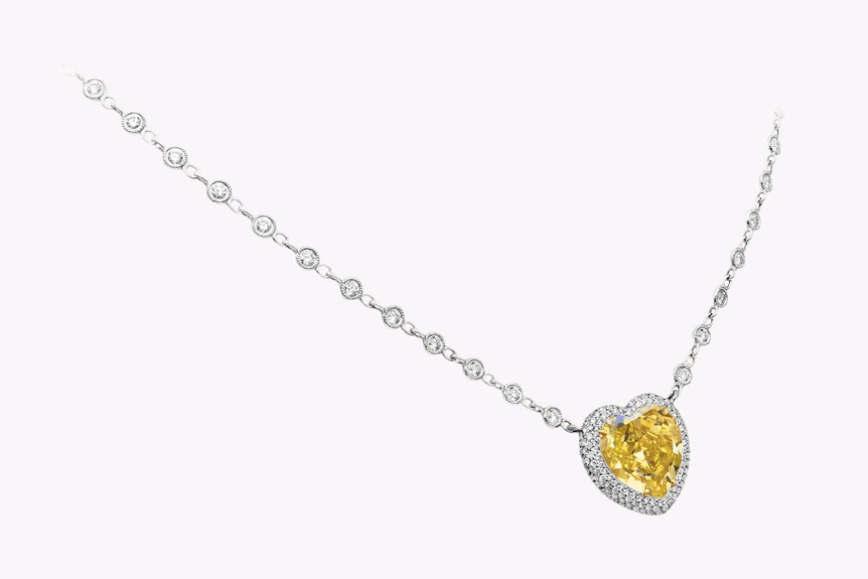 GIA Certified 7.77 Carats Heart Shape Yellow Diamond Pendant Necklace in Two-Tone Gold