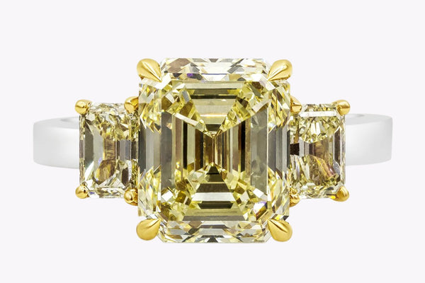 GIA Certified 5.17 Carats Emerald Cut Yellow Diamond Three-Stone Engagement Ring in Yellow Gold & Platinum