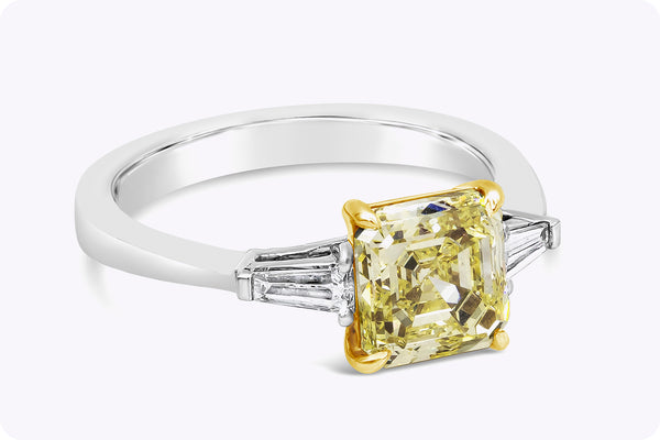 GIA Certified 2.13 Carats Asscher Cut Yellow Diamond Three-Stone Engagement Ring in Yellow Gold & Platinum