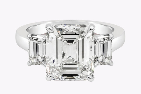 GIA Certified 5.16 Carats Emerald Cut Diamond Three-Stone Engagement Ring in Platinum