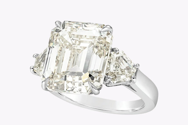 11.11 Carats Emerald Cut Diamond Three-Stone Engagement Ring in Platinum