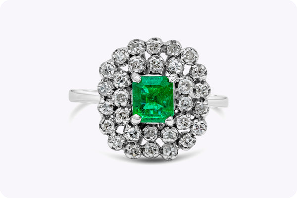 Antique 0.75 Carat Emerald Cut Emerald & Diamond Cluster Fashion Ring in White Gold