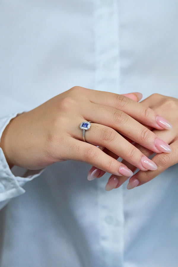 0.69 Carat Emerald Cut Sapphire & Baguette Halo Engagement Ring in Platinum