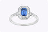 0.69 Carat Emerald Cut Sapphire & Baguette Halo Engagement Ring in Platinum