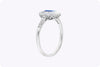 0.69 Carat Emerald Cut Sapphire & Baguette Halo Engagement Ring in Platinum