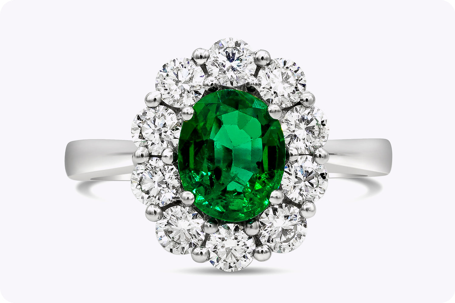 1.12 Carats Oval Cut Emerald & Diamond Halo Floral Engagement Ring in White Gold