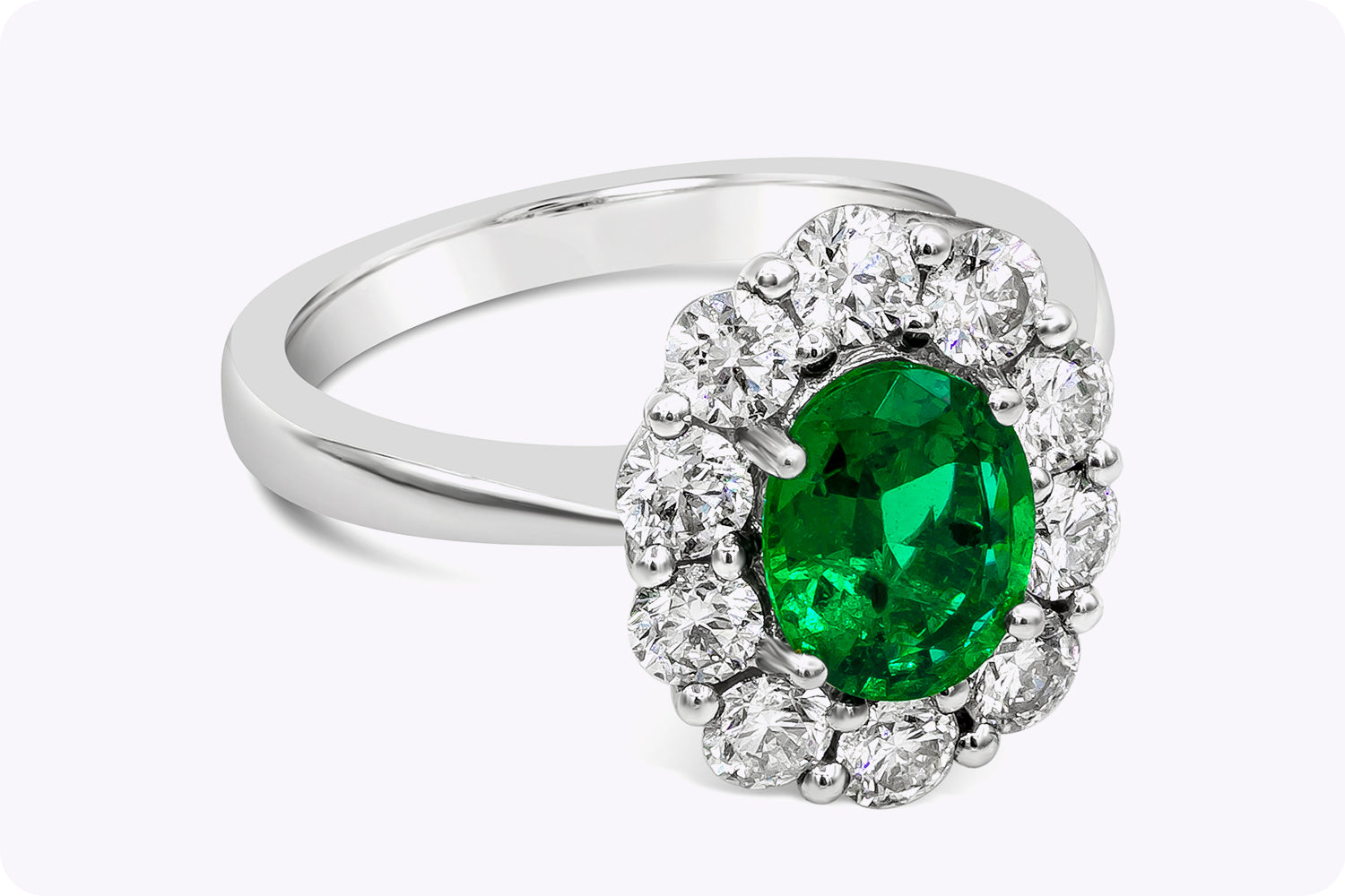 1.12 Carats Oval Cut Emerald & Diamond Halo Floral Engagement Ring in White Gold