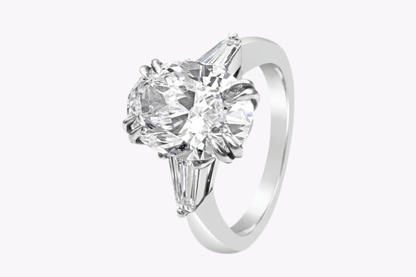 GIA Certified 4.01 Carats Oval Cut Diamond Three-Stone Engagement Ring in Platinum