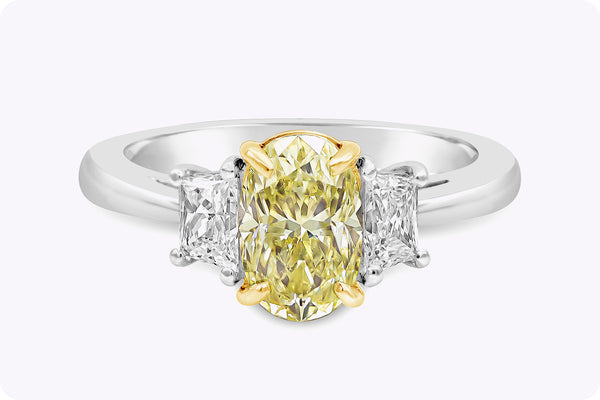 GIA Certified 1.57 Carats Oval Cut Yellow Diamond Three-Stone Engagement Ring in Yellow Gold & Platinum