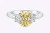 GIA Certified 1.57 Carat Oval Cut Yellow Diamond Three-Stone Engagement Ring in Platinum
