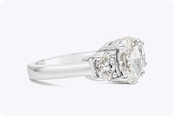 GIA Certified 2.21 Carat Oval Cut Diamond Three-Stone Engagement Ring in Platinum