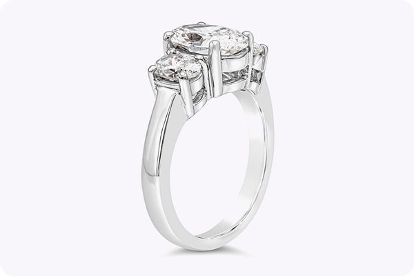 GIA Certified 2.21 Carat Oval Cut Diamond Three-Stone Engagement Ring in Platinum