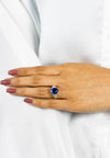GIA Certified 5.28 Carats Oval Cut Blue Sapphire with Diamonds Three-Stone Engagement Ring in Platinum