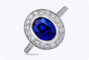 3.60 Carats Oval Cut Blue Sapphire and Diamonds Halo Engagement Ring in Platinum