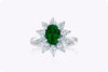 1.48 Carats Oval Cut Emerald & Diamond Halo Floral Engagement Ring in White Gold