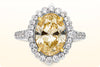 GIA Certified 3.39 Carats Oval Cut Fancy Intense Yellow Diamond Halo Engagement Ring in Yellow Gold & Platinum