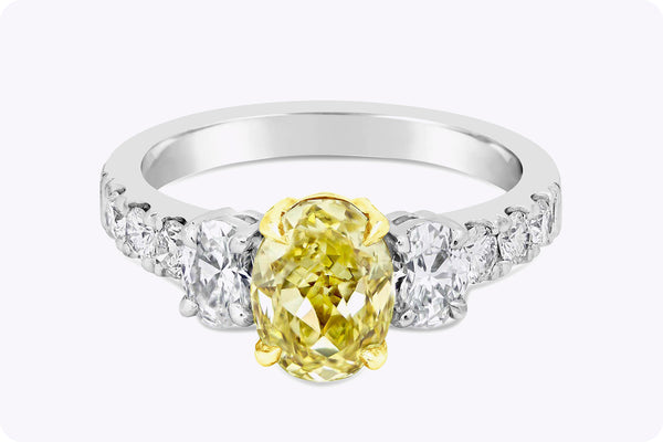 GIA Certified 1.53 Carats Oval Cut Yellow Diamond Three-Stone Engagement Ring in White Gold