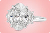 GIA Certified 5.11 Carats Oval Cut Diamond Three-Stone Engagement Ring in Platinum
