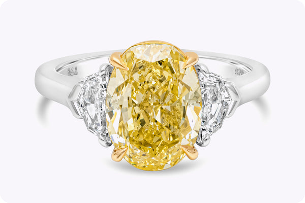 GIA Certified 4.12 Carats Oval Cut Yellow Diamond Three-Stone Engagement Ring in Yellow Gold & Platinum