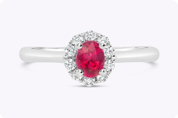 0.53 Carat Oval Cut Ruby & Diamond Halo Engagement Ring in White Gold