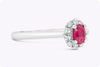 0.53 Carat Oval Cut Ruby & Diamond Halo Engagement Ring in White Gold